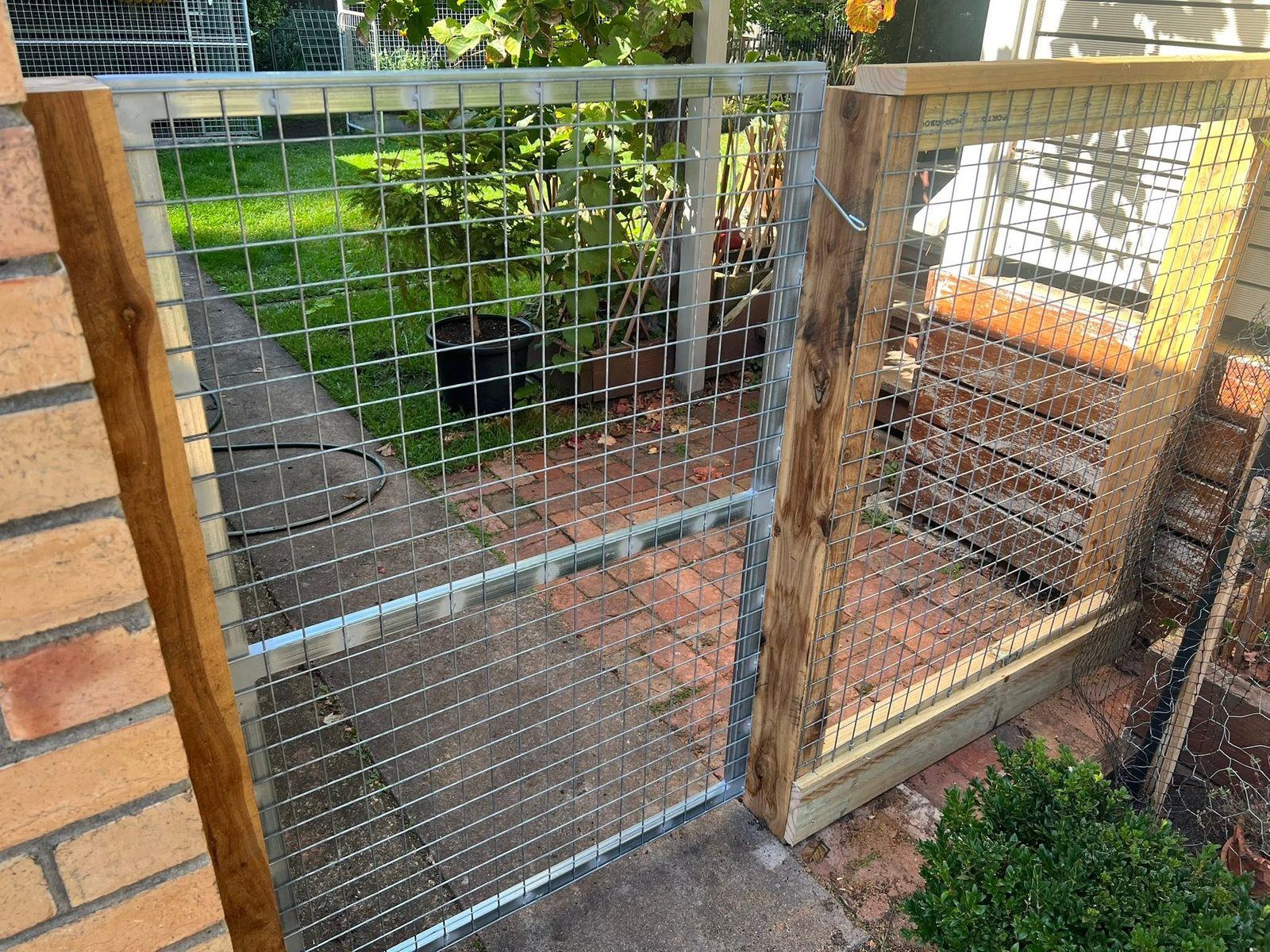 Galvanised weldmesh gate in a timber frame, garden enclosure