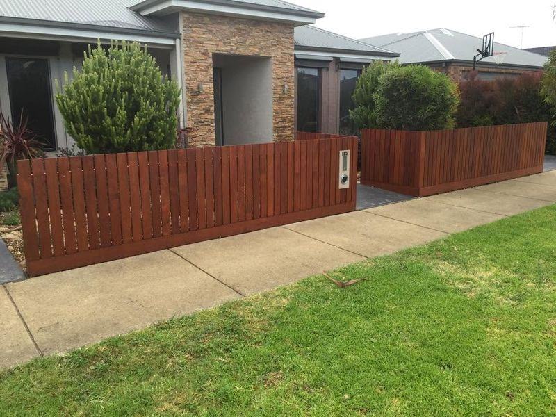 Oiled merbau front fence with planter box returns