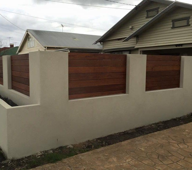 Rendered wall with horizontal timber infill panels
