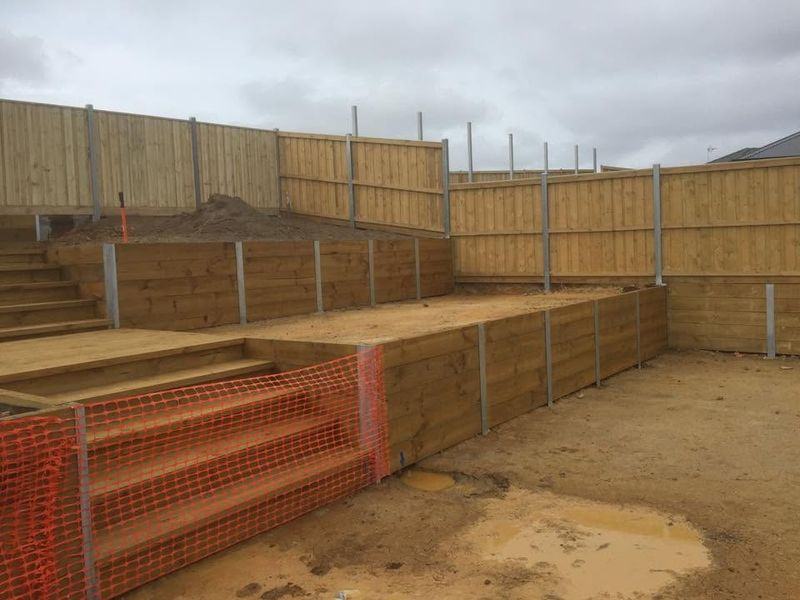 Stepped sleeper retaining walls with galvanised posts